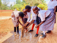 using a clean water tap in nyeri kenya